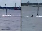 A Navy base worker is in critical condition after a shark attack during a lunchtime swim, with the frightening incident captured on video. 