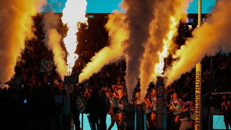 Port Adelaide players run out at Adelaide Oval for their Gather Round game against St Kilda. (Matt Turner/AAP PHOTOS)