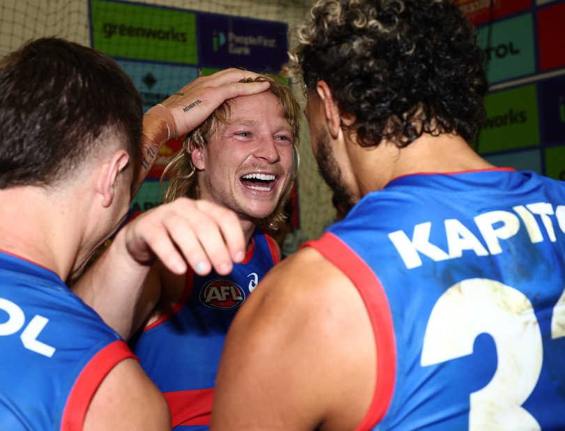 Cody Weightman and Arthur Jones of the Bulldogs after the song.