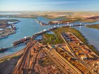 The militant AMWU and ETU have voted to down tools at Australia’s most lucrative iron ore port. 