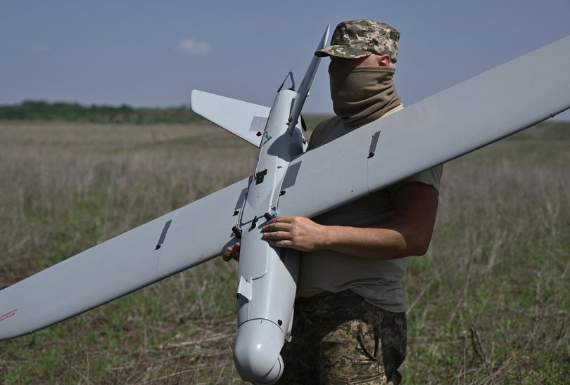 A Ukrainian serviceman of the 22nd Brigade prepares to fly a Leleka reconnaissance UAV drone near Chasiv Yar in the Donetsk region.