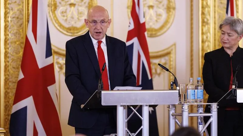 UK Defence Minister John Healy quits before meeting Australian counterpart Richard Marles, cites underspending