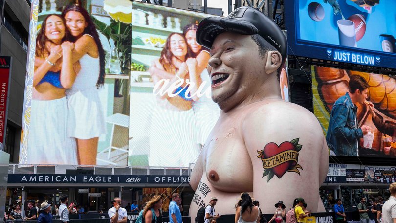 An inflatable statue protesting Elon Musk in Times Square ahead of SpaceX’s IPO in New York on Thursday.
