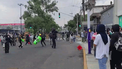Members of the anti-World Cup bloc clash with police outside the Mexico City Stadium.