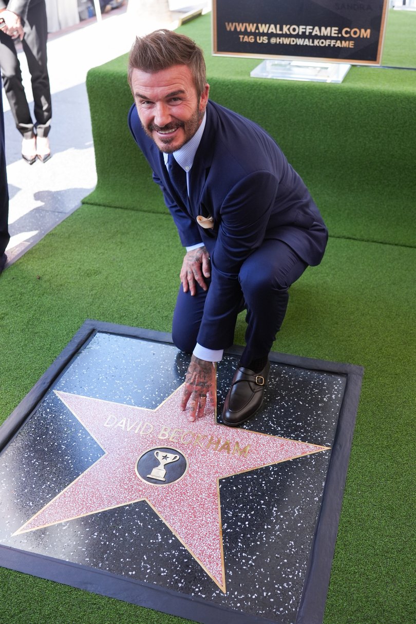 David Beckham poses with his new star.