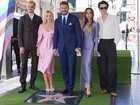 From left: Romeo, Harper, David and Victoria Beckham, and Cruz pose with Sir David’s new star .