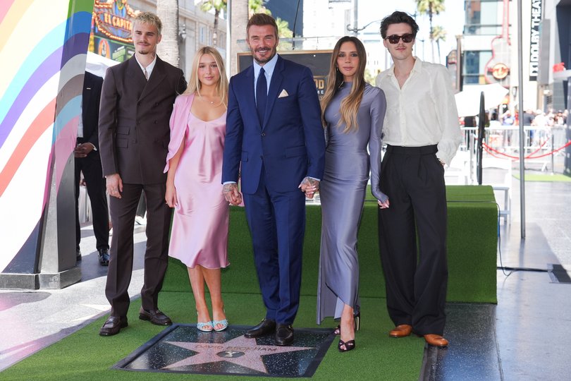 From left: Romeo, Harper, David and Victoria Beckham, and Cruz pose with Sir David’s new star .