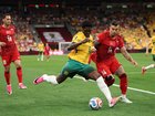 Mohamed Toure #9 of Australia passes the ball under pressure of Abdulkerim Bardakci #14 of Turkiye.
