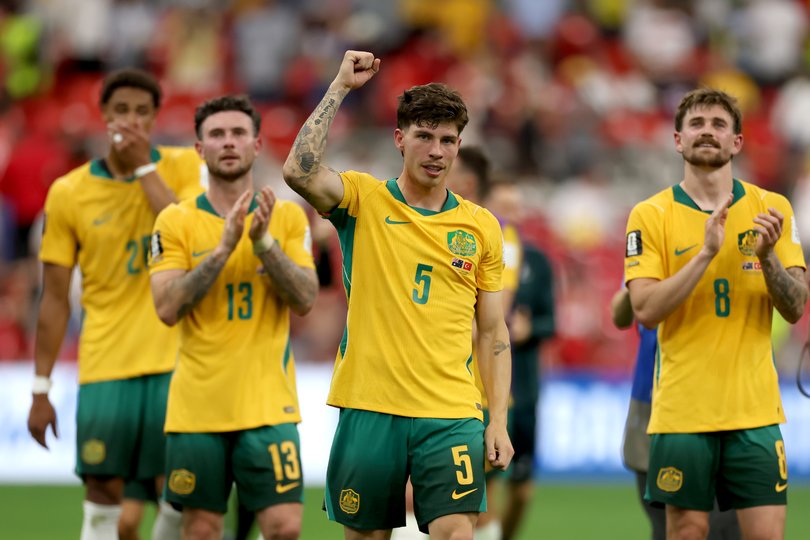 Jordan Bos and the Socceroos celebrate.
