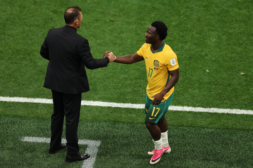 Popovic with Irankunda.