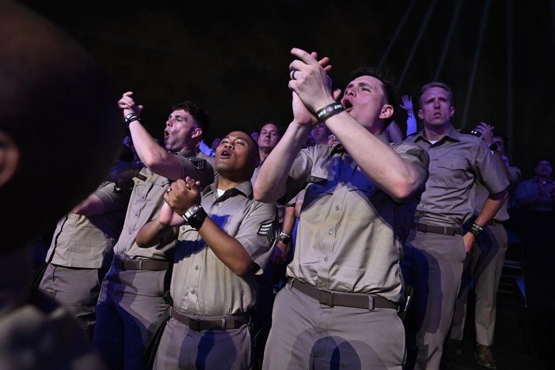 Members of the military cheer during UFC Freedom 250.