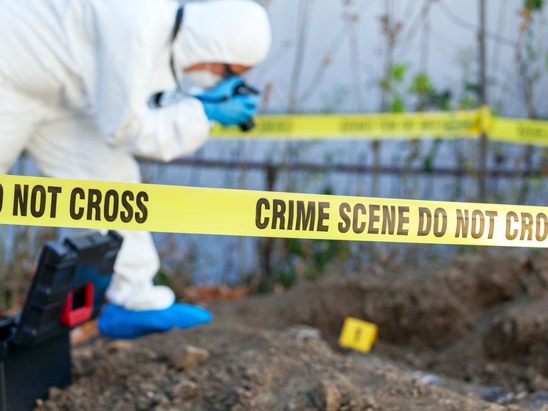 A pathologist has been arrested after the bodies of more than 30 babies were found on a property by construction workers who were conducting earthworks in her former backyard.