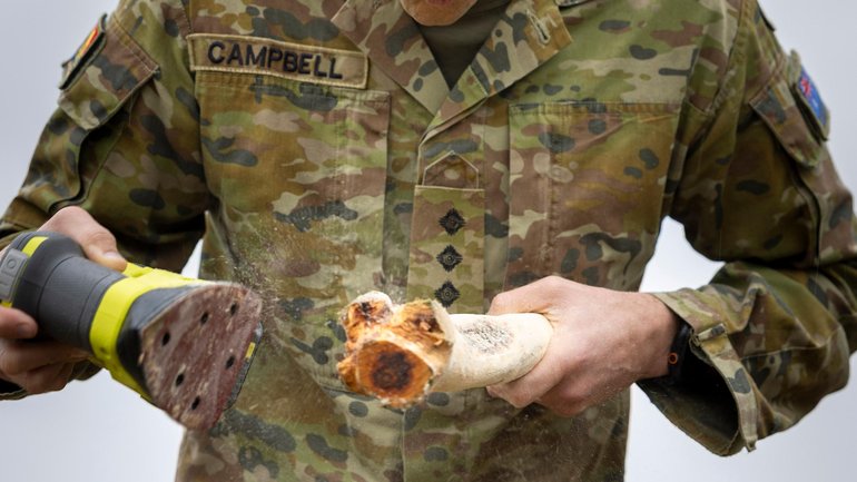 Captain Thomas Campbell from Queensland University Regiment prepares a Boondi during Exercise Greenskin in Canberra. 