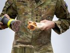 Captain Thomas Campbell from Queensland University Regiment prepares a Boondi during Exercise Greenskin in Canberra. 