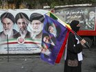 People in Tehran gather in support of Iran’s new leader, Seyyed Mojtaba Khamenei, while holding the Iranian flag and images of both the new and former leaders of Iran.