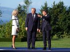 President Donald Trump, center, during a welcome ceremony hosted by President Emmanuel Macron of France, right, and his wife, Brigitte Macron, at the G7 Summit in Evian-les-Bains, France.