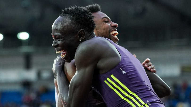 Gout Gout celebrates with Noah Lyles after the finish as both set world-best times.
