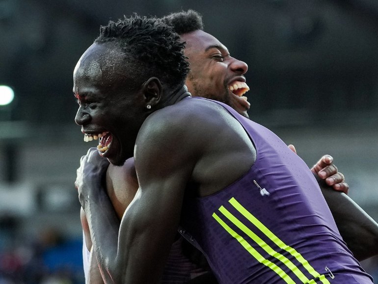 Gout Gout celebrates with Noah Lyles after the finish as both set world-best times.