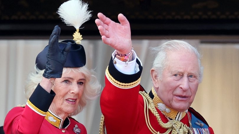 Charles pictured wearing two friendship bracelets under his traditional red uniform.