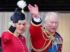 Charles pictured wearing two friendship bracelets under his traditional red uniform.
