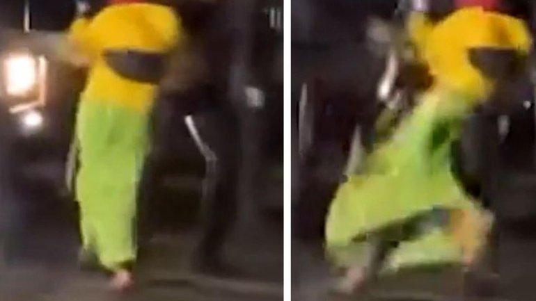 Disturbing footage of a female protester being shoved to the ground by a police officer has sparked a review.