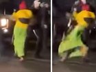 Disturbing footage of a female protester being shoved to the ground by a police officer has sparked a review.