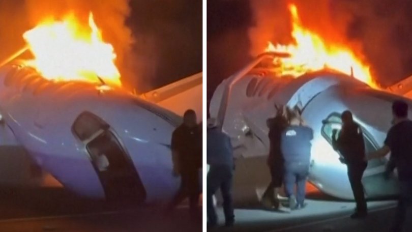 Heroic bystanders can be seen racing to the burning wreckage of a plane crash on a US highway in a bid to free passengers trapped inside.
