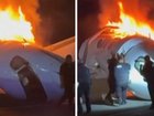 Heroic bystanders can be seen racing to the burning wreckage of a plane crash on a US highway in a bid to free passengers trapped inside.