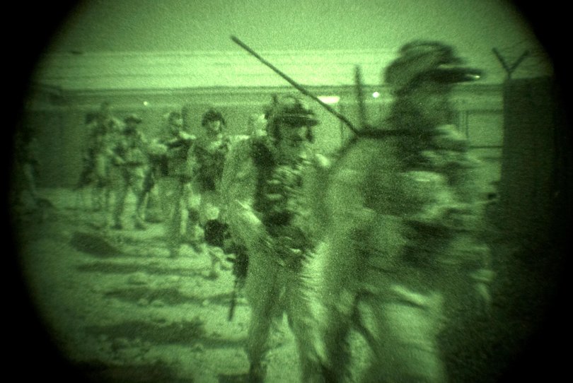 Members of the Special Operations Task Group (SOTG) prepare to embark on a night time operation in Oruzgan Province, Afghanistan.