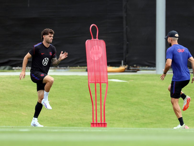 Christian Pulisic of the United States participates away from other players during a training session.