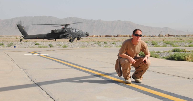 Captain Naomi Rogusz conducts final checks before departing on task from Kandaher Airfield, Afghanistan.