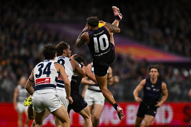 Shai Bolton of the Dockers flies for a mark.