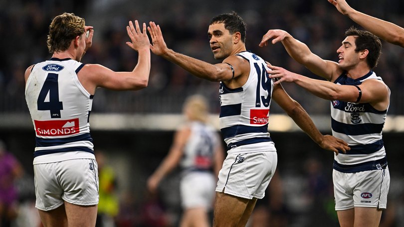 Jack Martin of the Cats celebrates a goal.