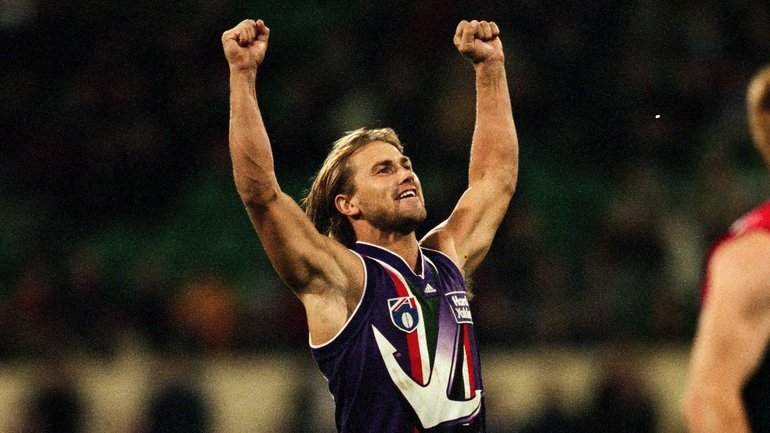 Tony Modra of the Dockers celebrates a goal during the 1999 round 10 AFL match between the Melbourne Demons and the Fremantle Dockers at the Melbourne Cricket Ground.