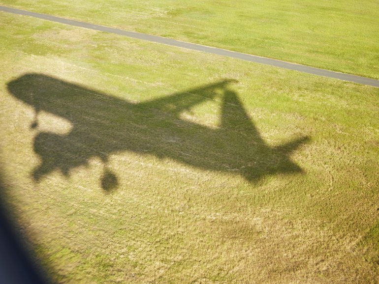 The body of a man has been found inside the landing gear of a plane at a London airport.