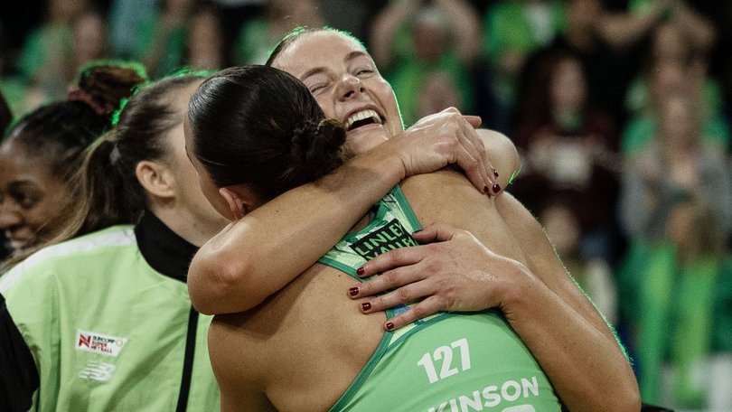 Fever players celebrate Sunday’s win.