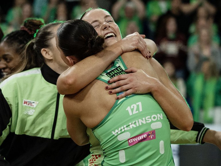 Fever players celebrate Sunday’s win.