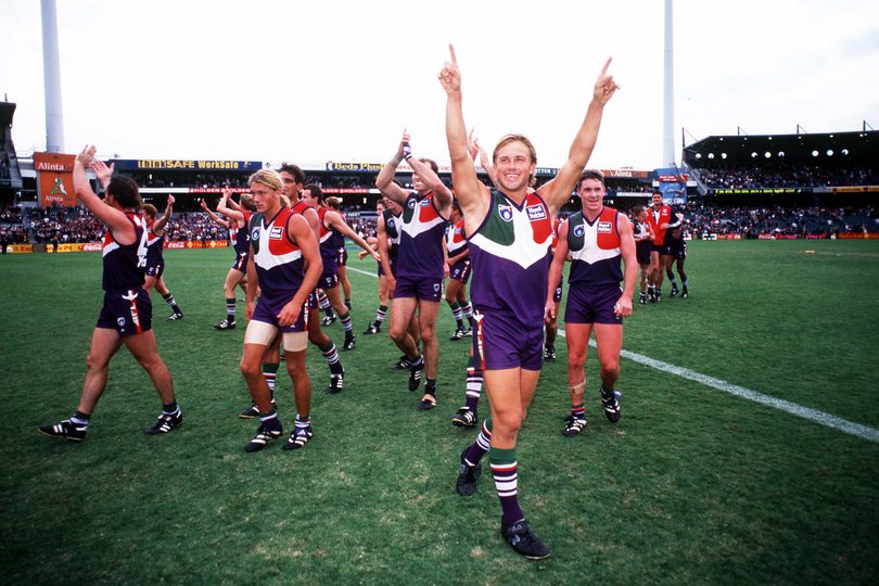 Tony Modra for Fremantle celebrates with team.