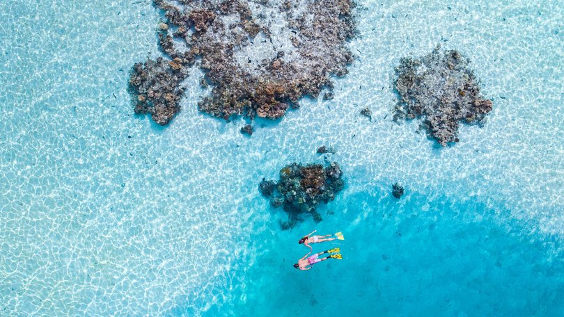 White sandbanks and turquoise lagoons create the postcard-perfect side of Aitutaki.