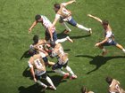 Alex Freeman #16 of the United States celebrates with teammates after scoring his team's second goal.