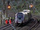 Emergency personnel work on a train on the tracks outside Bedford, England, after a train from Corby to London St. Pancras and another from Nottingham to London St. Pancras, collided.