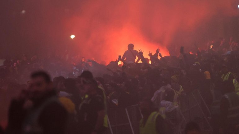 Flares were set off among the crowd of thousands as Fans watched the Socceroos take on the USA. (Con Chronis/AAP PHOTOS)