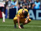 Wayne Rooney says the Socceroos were 'awful' in the opening half of their clash with the US. (AP PHOTO)