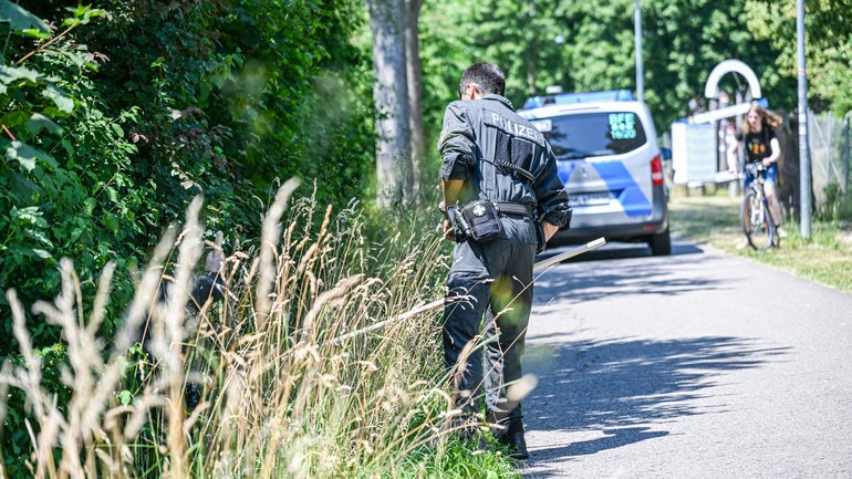 Police officers are on the scene searching for a missing toddler. 