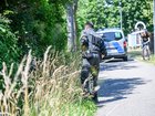 Police officers are on the scene searching for a missing toddler. 