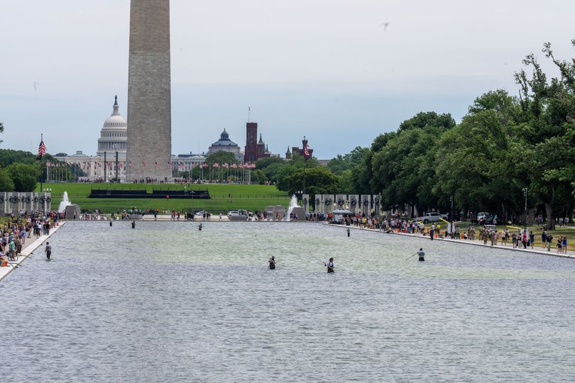 A National Park Service crew works to clean algae from the Lincoln Memorial Reflection Pool in Washington on Friday.
