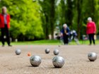 A man is dead and another is in custody after an argument reportedly broke out about pétanque boules.