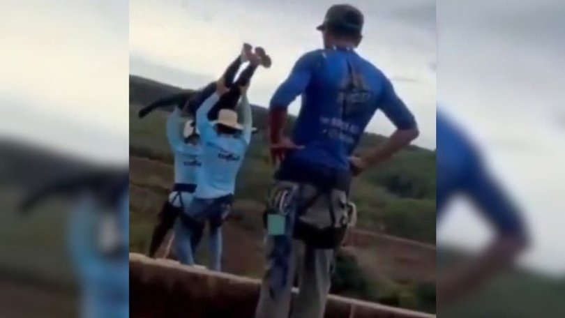 Video captured the moment Freitas was carried to the edge of the bridge and thrown off without a rope.