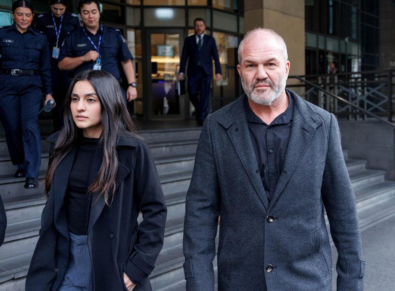 Abraham Abass (right) and supporters of 53-year-old Kawsar Ahmad (also known as Abbas) leaving the Magistrates Court.