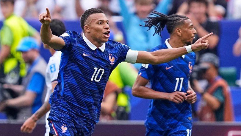 Kylian Mbappe has blasted home a brace in his milestone match for France against Iraq. (AP PHOTO)